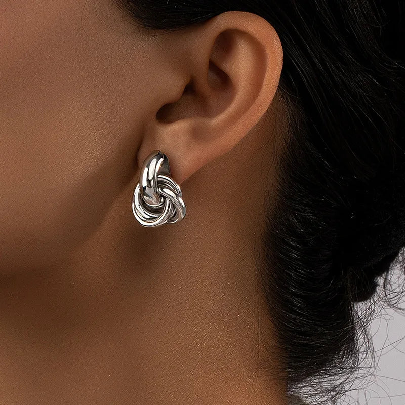 Atomica mini hoop earrings sleek minimalist silhouette polished non-tarnish finish everyday elegance