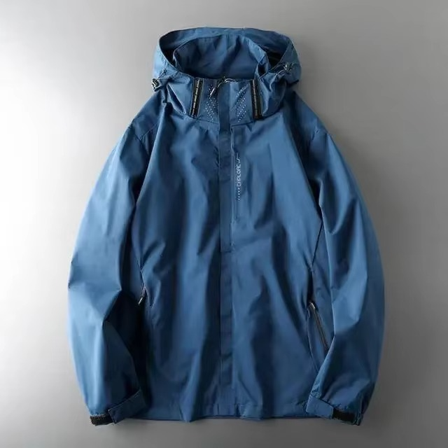 Men's lightweight waterproof windbreaker jacket in versatile colorblock design with packable hood