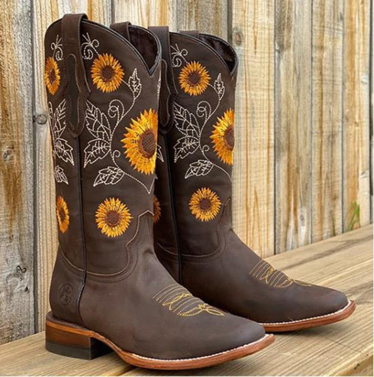 Violet women's cowgirl boots with sunflower embroidery, classic western silhouette, rustic charm style