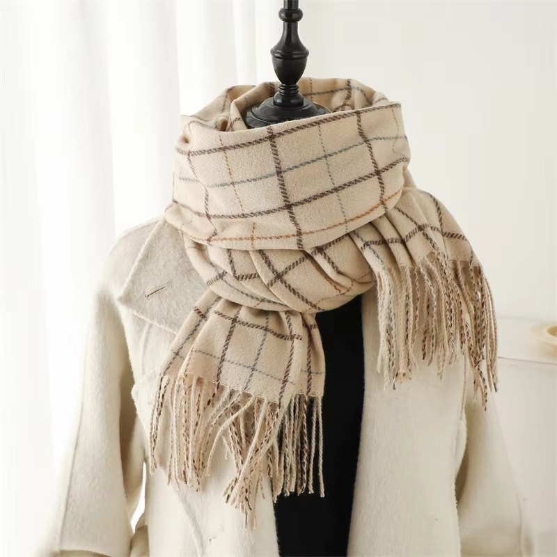 Women's plaid cashmere-blend winter scarf in warm tones with thick woven texture and tassel ends