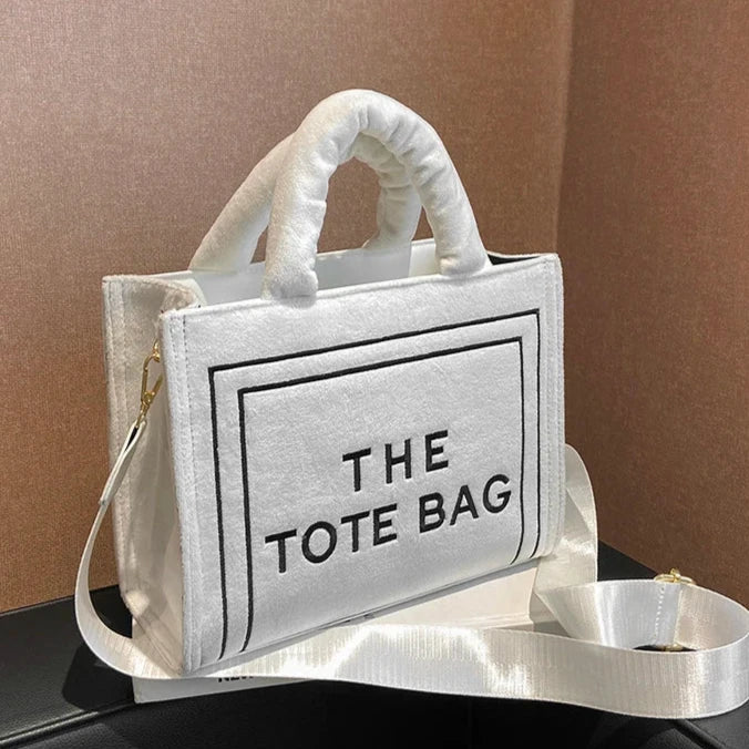 Urbann-Vibe velour tote bag with signature letter print, spacious interior, plush sheen finish