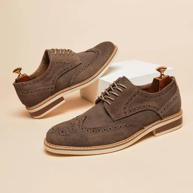 Men's brown suede wingtip Oxford shoes with double-stitch construction and slip-resistant sole