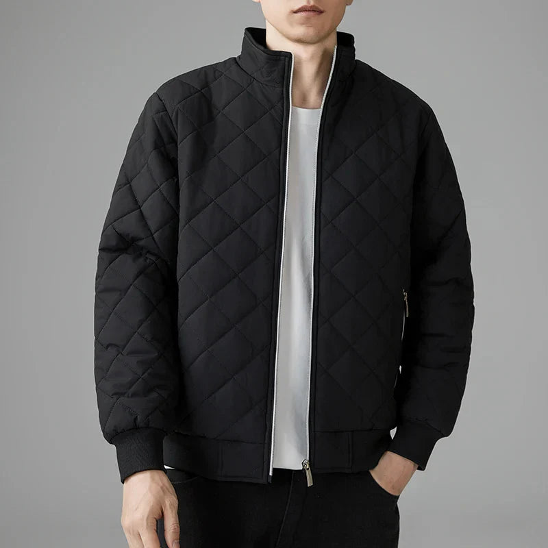 Men's navy blue padded quilted jacket with adjustable hem and high-performance insulation