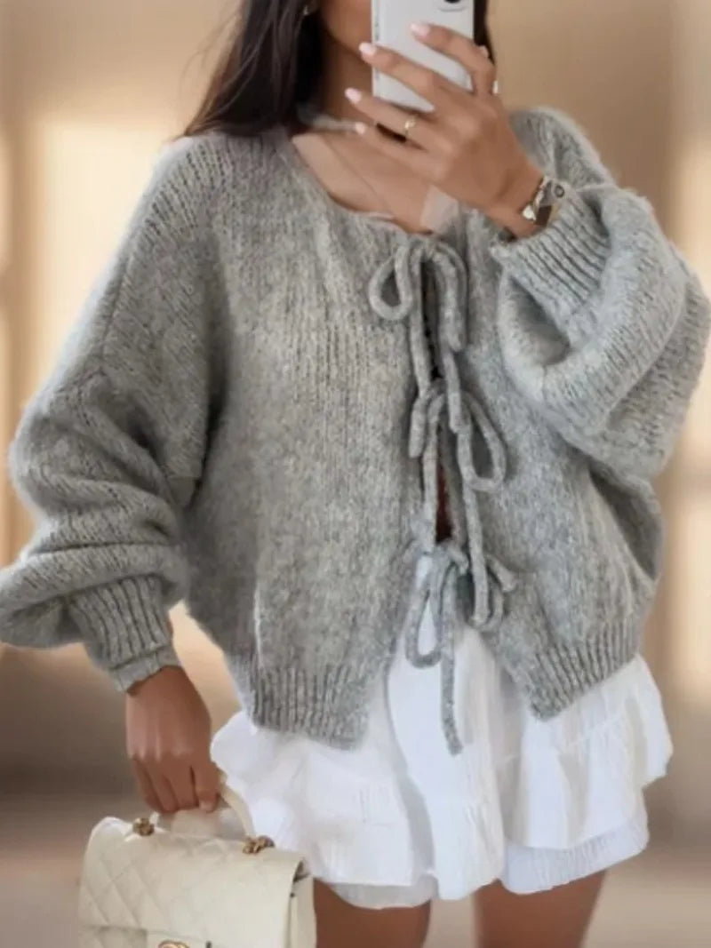Women's cozy knit cardigan boho style with bow tie closure, relaxed silhouette, warm layering piece