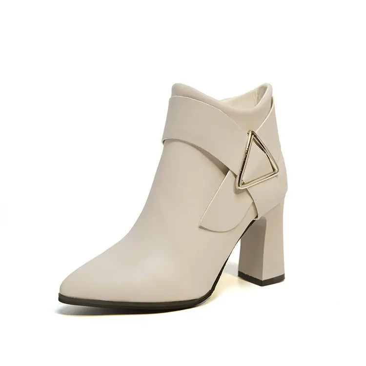 Women's black high heel boots with sleek silhouette and distinctive geometric triangle buckle accent