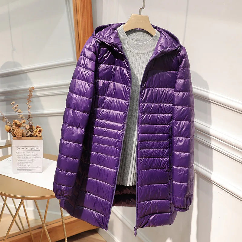 Women's long puffer jacket with hood, regular fit, elongated silhouette for cold-weather warmth