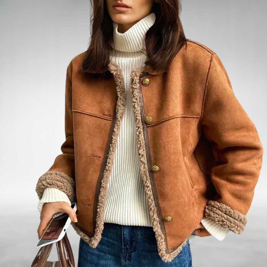 Women's camel shearling trim jacket with plush cuffs, structured silhouette, and minimalist winter style