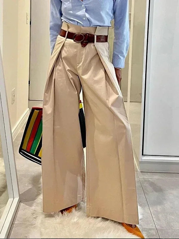 Women's high waist wide leg pleated suit pants in neutral tone, professional elegant silhouette