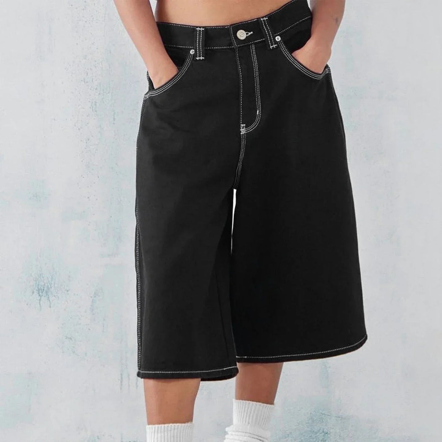 Men's wide-leg denim shorts in washed blue with relaxed fit and reinforced five-pocket stitching