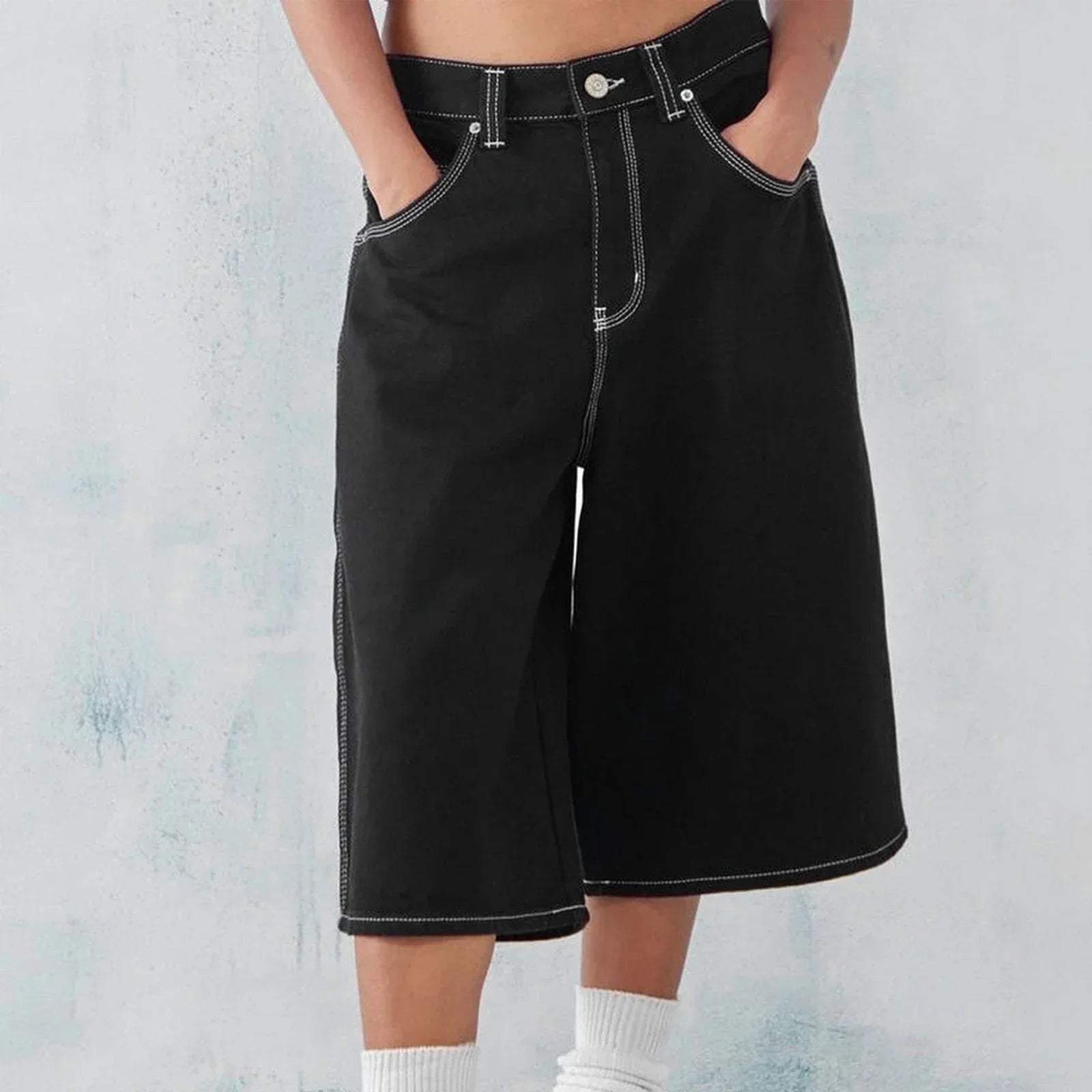 Men's wide-leg denim shorts in washed blue with relaxed fit and reinforced five-pocket stitching
