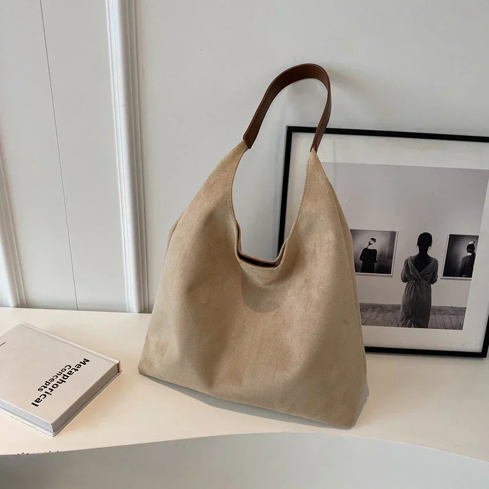 Minimalist women's tote shoulder bag in neutral tone with spacious interior and clean silhouette
