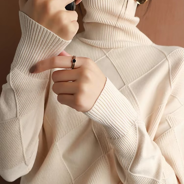 Women's oversized turtleneck knit sweater in cozy soft acrylic blend with relaxed pullover silhouette