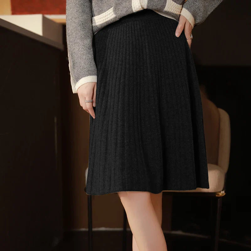 Women's brushed wool ribbed knit skirt with subtle pleated flare, soft cozy warm silhouette