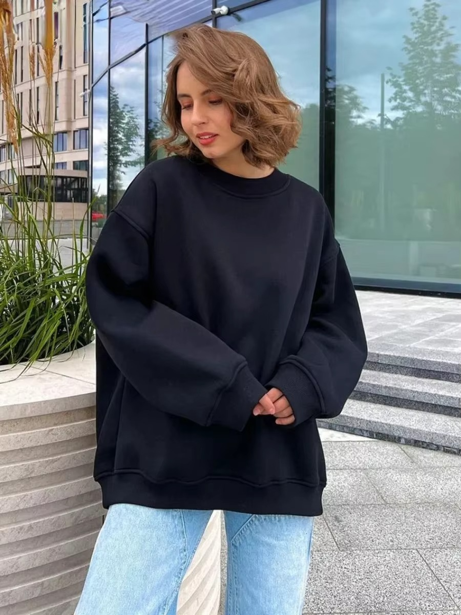 Women's oversized fleece hoodie pullover in cozy loose fit with plush warm fabric for casual style