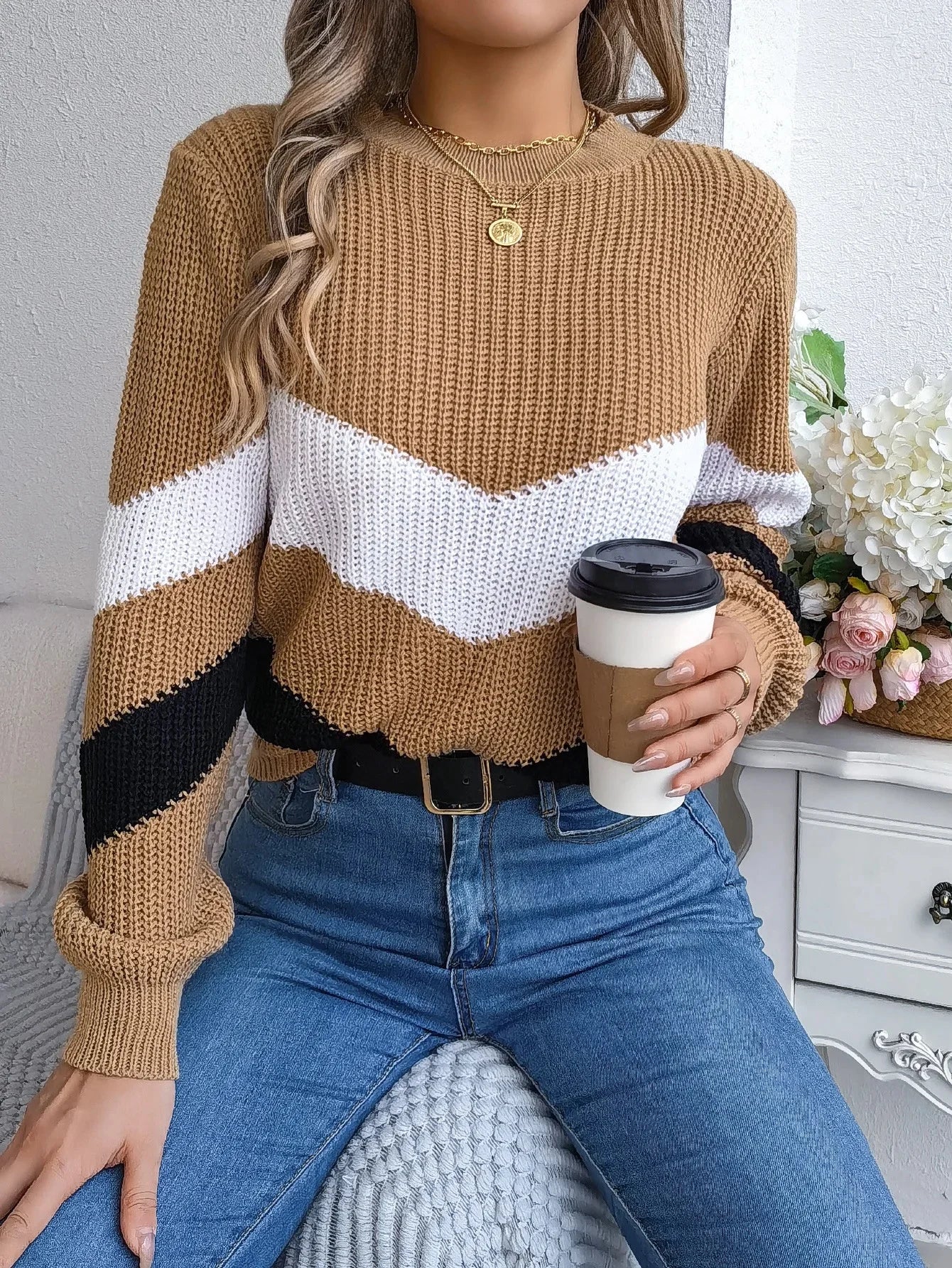 Women's cashmere turtleneck sweater with bold chevron color-block pattern, relaxed fit for cozy winter warmth