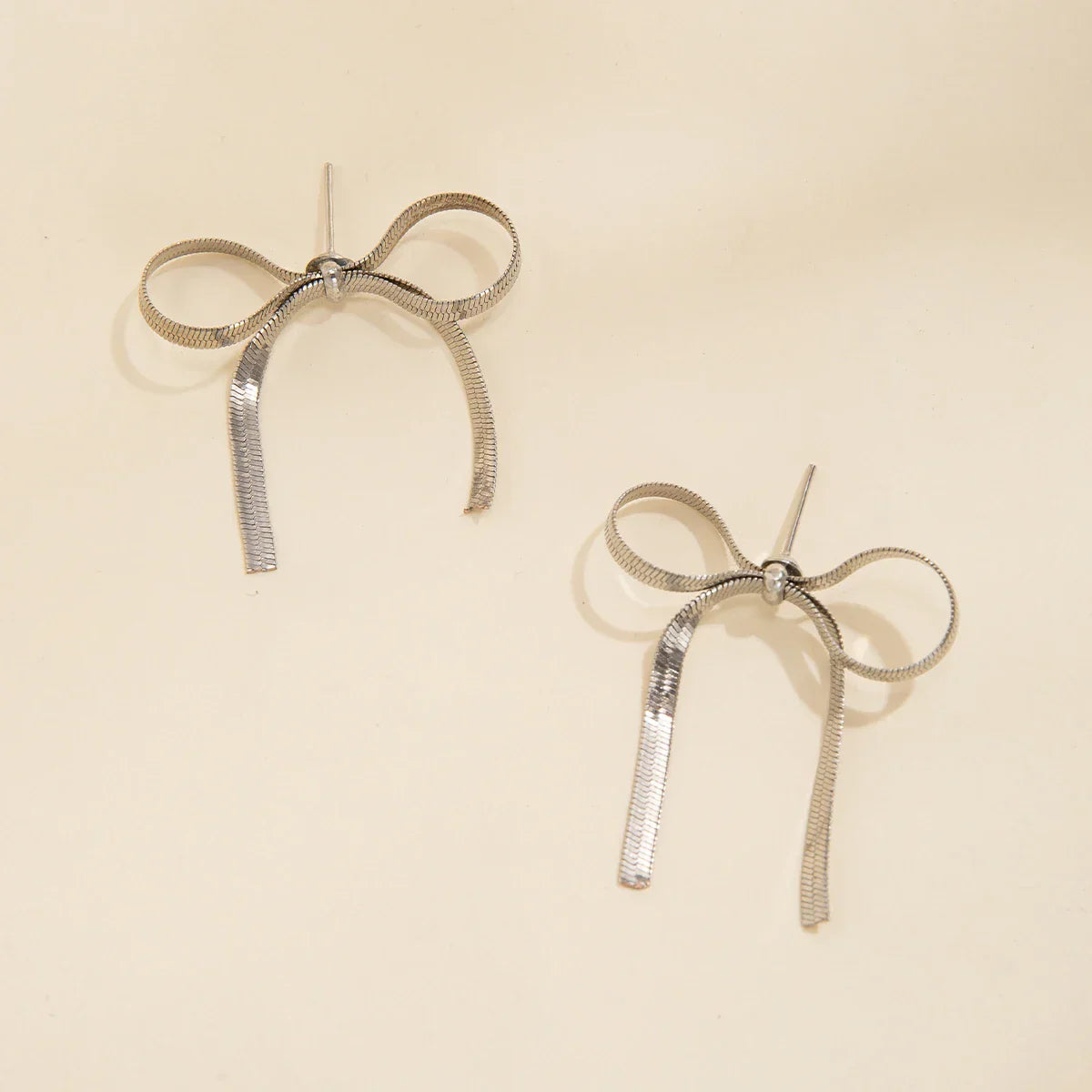 Angel bow earrings gold silver finish ribbed tassels lightweight copper alloy symbolic gift her