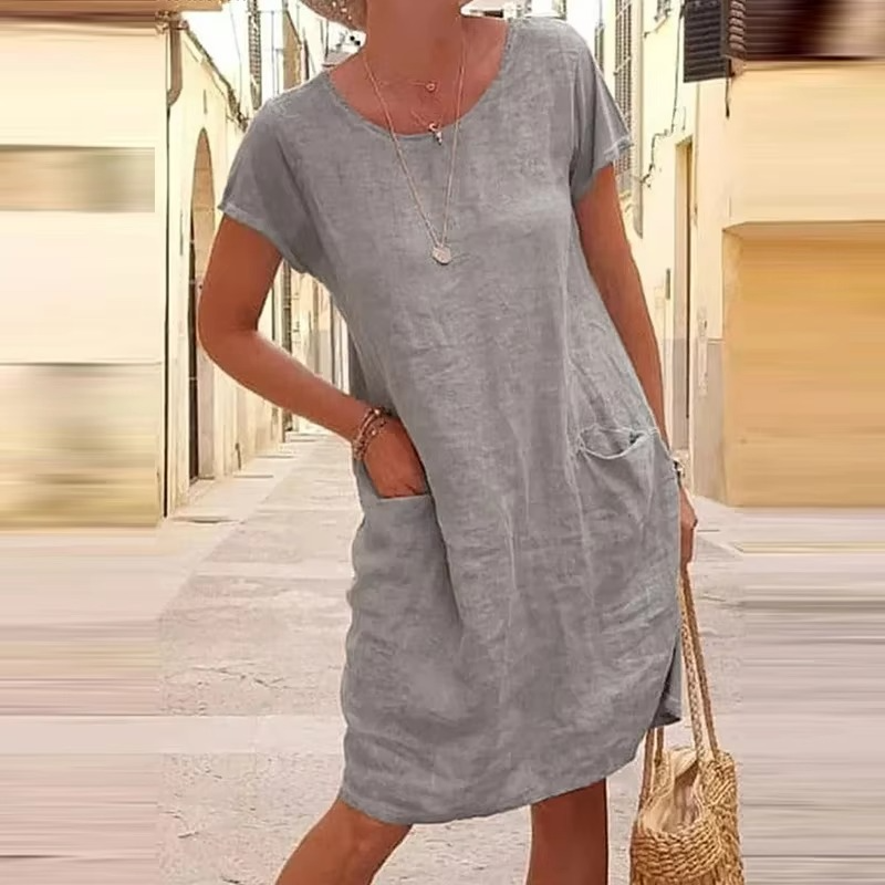Women's relaxed fit solid color pocket dress, breathable summer style with loose short-sleeve silhouette