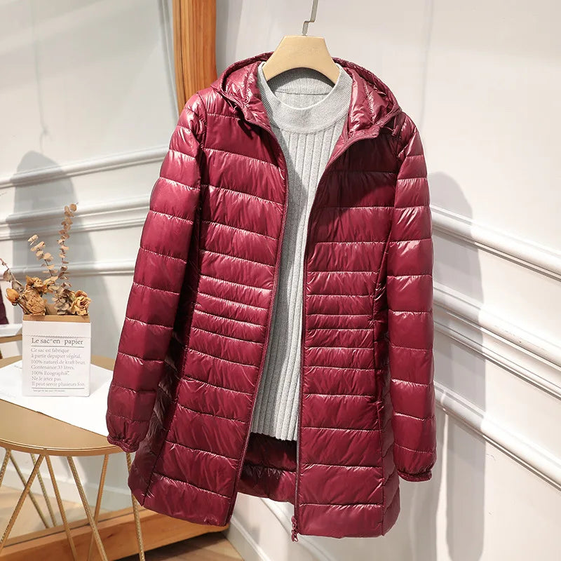 Women's long puffer jacket with hood, regular fit, elongated silhouette for cold-weather warmth
