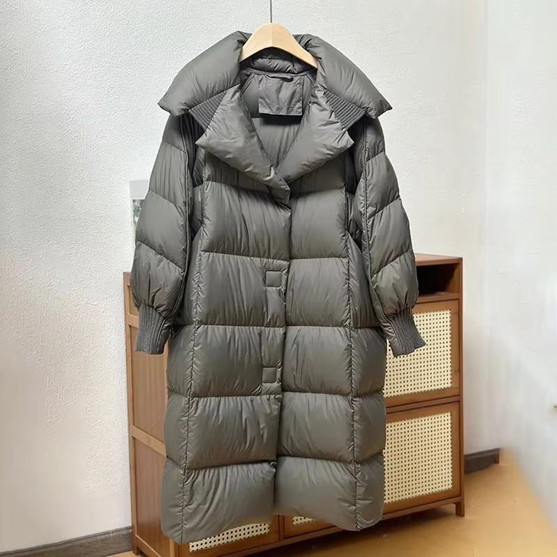 Women's long oversized down coat in neutral tone, premium white duck down fill winter outerwear