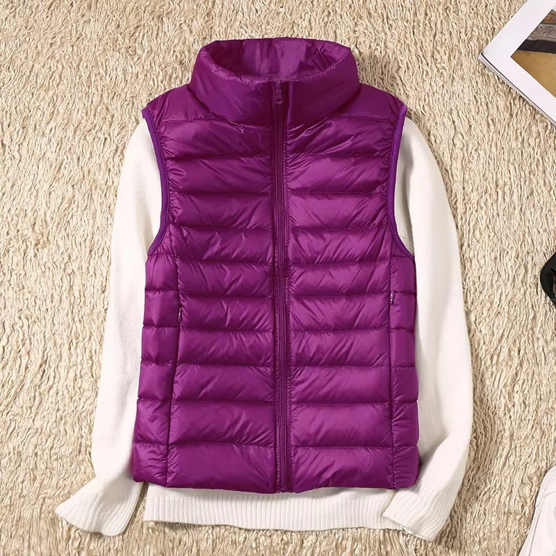 Women's cropped sleeveless down puffer vest lightweight nylon shell for layering outdoor adventures