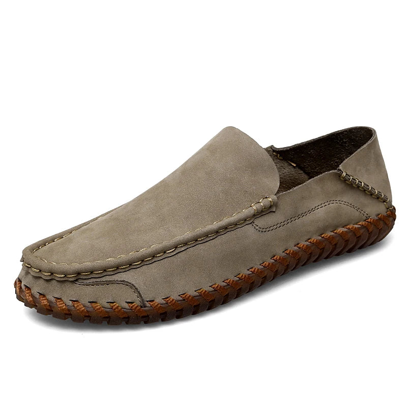 Men's brown leather moc toe loafers with braided trim detail, classic slip-on style