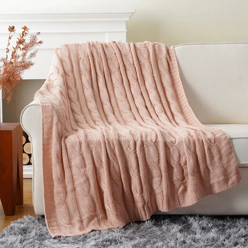 Ultra-soft cable knit throw blanket in neutral tones, textured chunky weave for bed and sofa decor