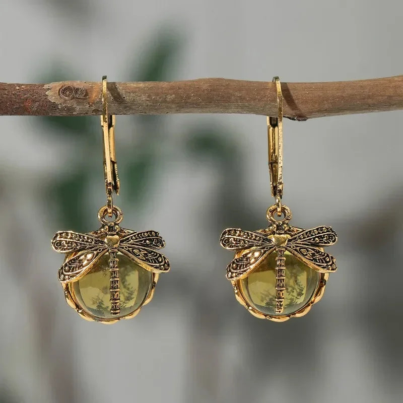 Dragonfly antique earrings pale blue crystal cabochon brass wings intricate carved vintage gold-tone setting