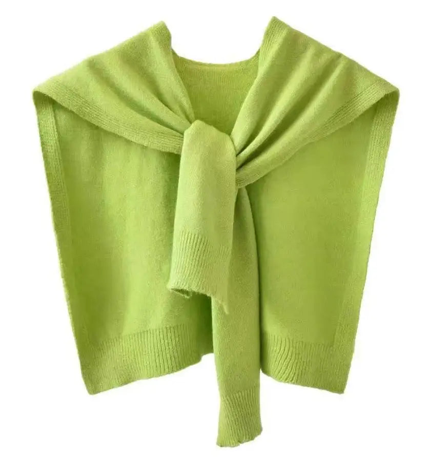 Women's knitted scarf wrap in cozy sweater-inspired texture with ribbed hem finish for versatile layering