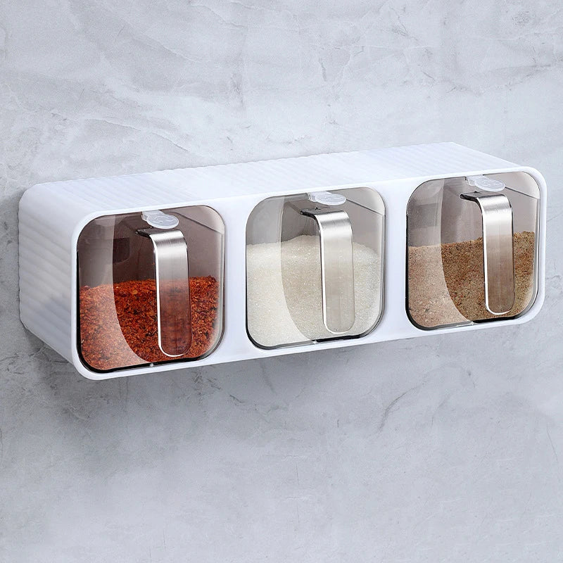 Wall-mounted spice organizer box with transparent lids and scoops for compact kitchen storage