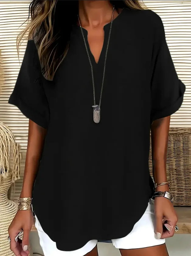 Flowy V-neck tunic blouse in casual style with rolled cuffs and rounded hem for women