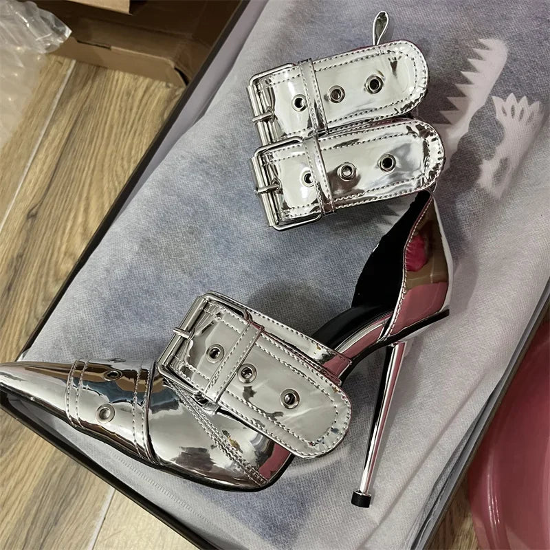 Metallic silver stiletto pumps with buckle detail, pointed-toe punk-glam design for nightlife