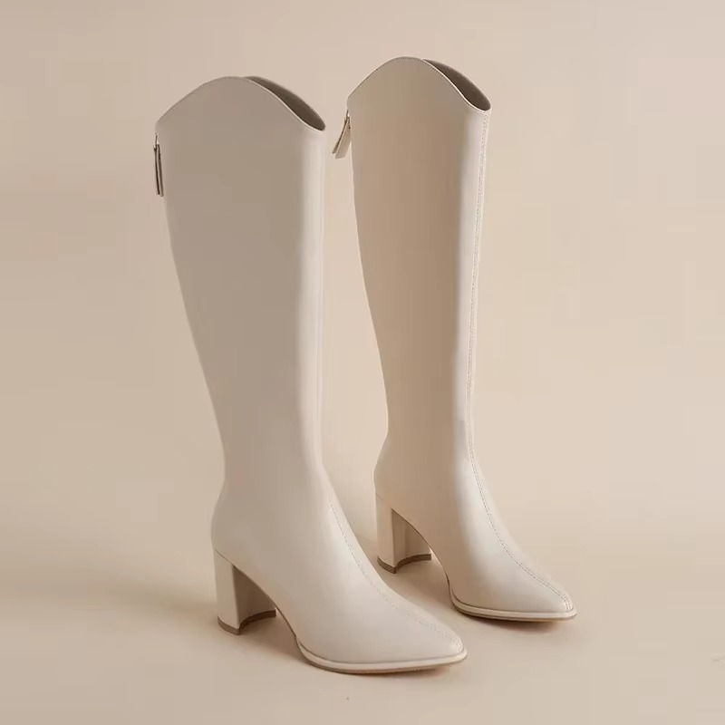 Plus size women's knee high boots with chunky block heel, side zip closure, bold fashion-forward silhouette