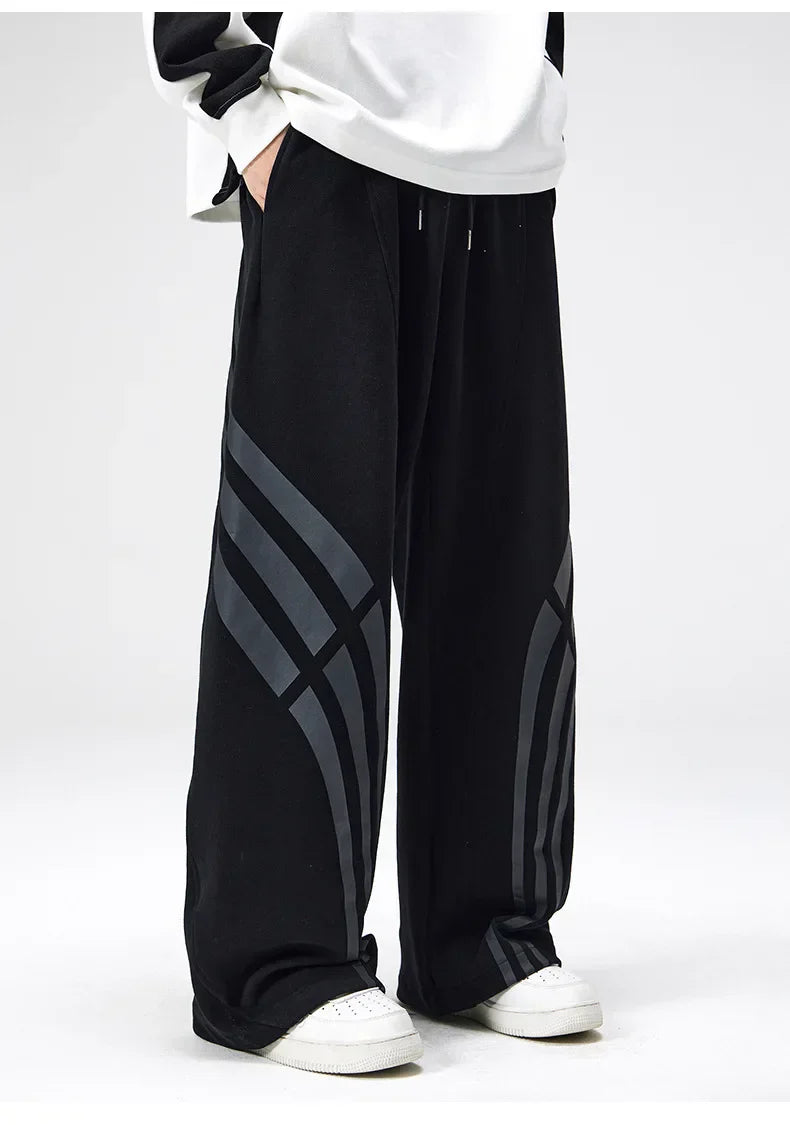 Gray straight fit sweatpants with vintage warped stripe design and wide flared leg for streetwear