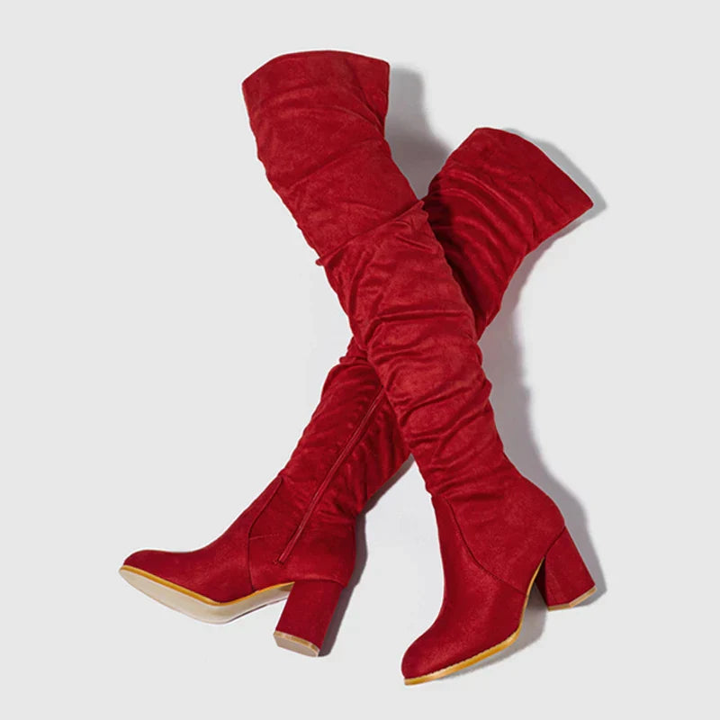 Women's black over-the-knee heeled boots with sleek fitted silhouette for leg-elongating glamour