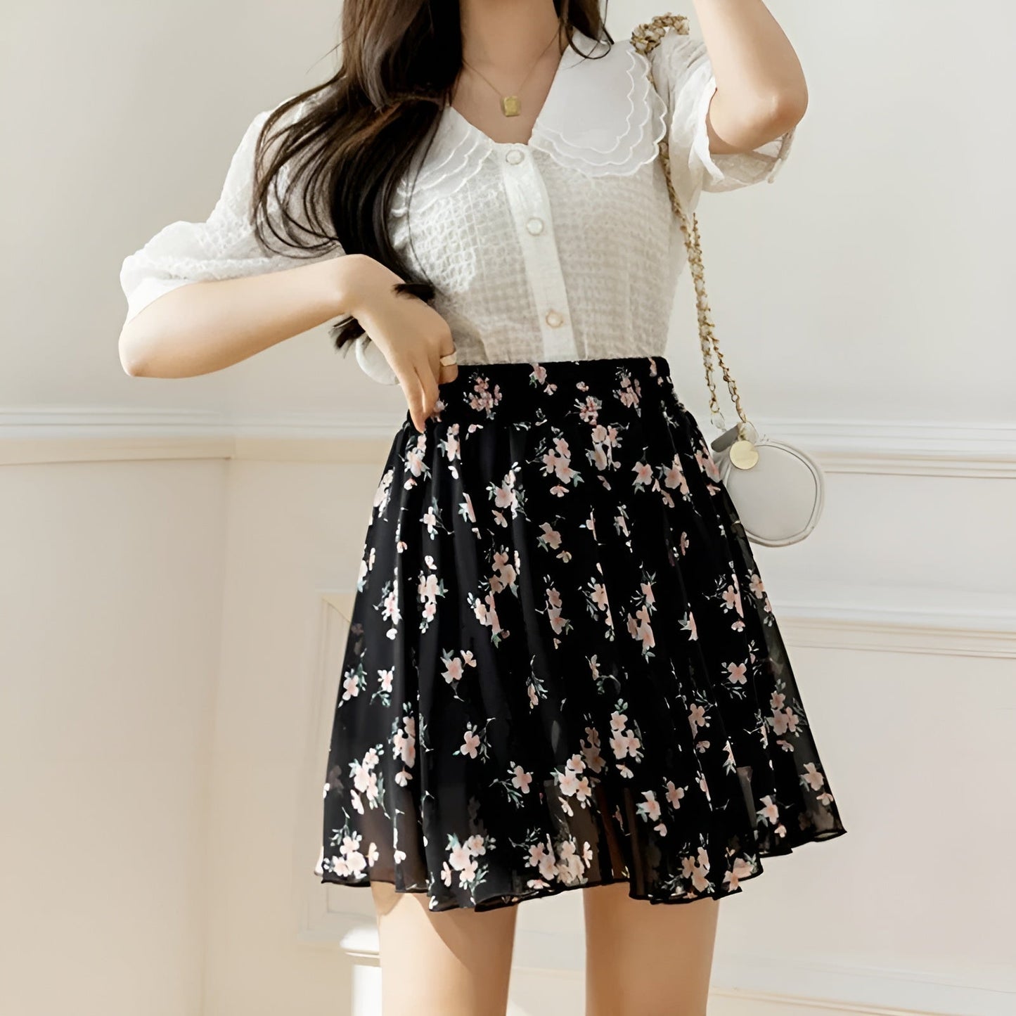 Floral chiffon mini skirt with cinched high waist, dainty pleats, and breezy flared silhouette