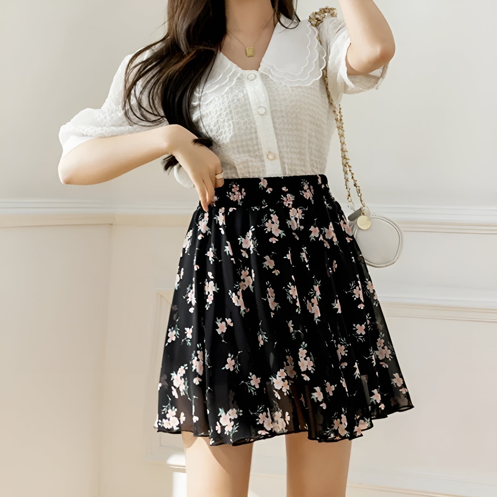 Floral chiffon mini skirt with cinched high waist, dainty pleats, and breezy flared silhouette