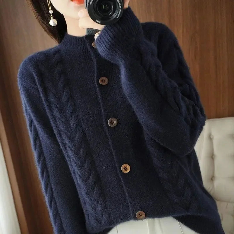 Women's cream cable knit button-front cardigan with intricate textured pattern for versatile layering