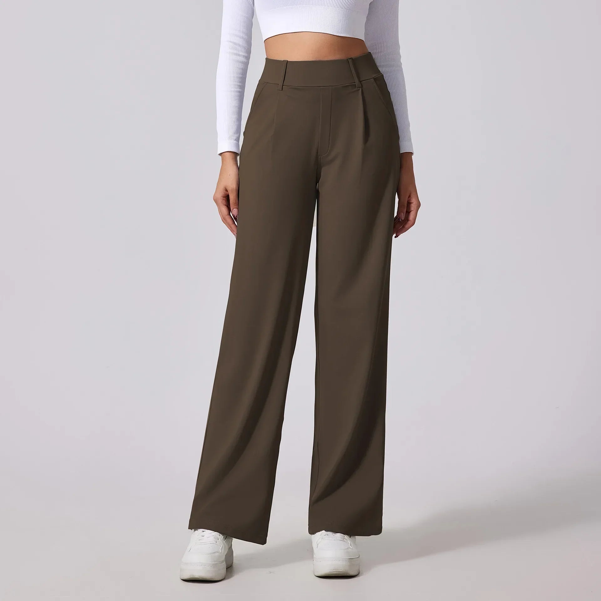 Women's high-waist sculpting slacks in neutral tone with fluid drape and tailored professional fit