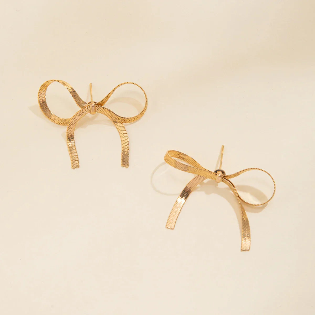 Angel bow earrings gold silver finish ribbed tassels lightweight copper alloy symbolic gift for her