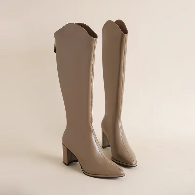 Plus size women's knee high boots with chunky block heel, side zip closure, bold fashion-forward silhouette