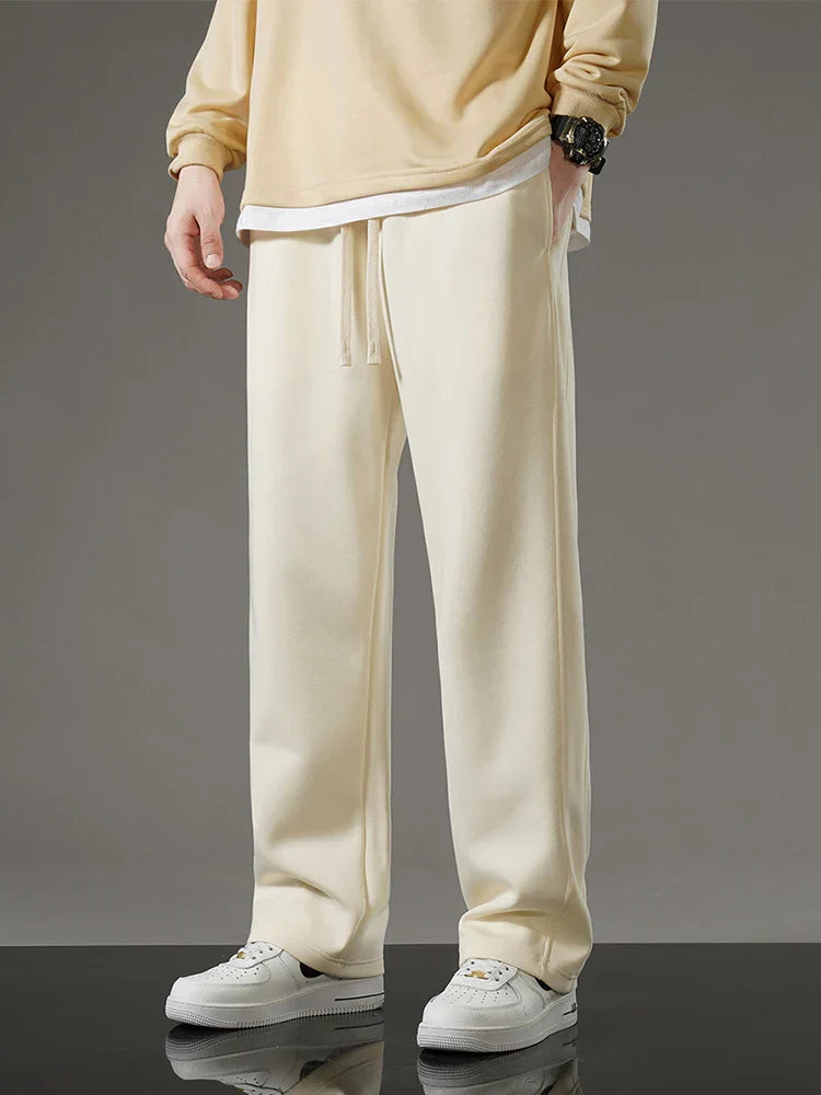 Men's relaxed fit sweatpants in neutral tone with roomy silhouette for all-day casual comfort