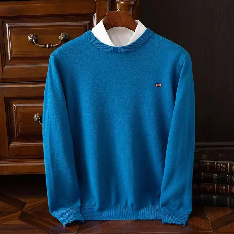 Lightweight crewneck knit sweater in neutral tone, smooth fine-knit texture, unisex tailored fit