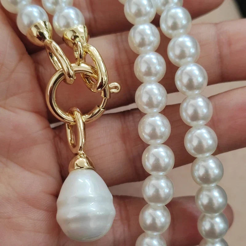 Bold statement pearl necklace with oversized pearls, durable chain, and large pendant for women