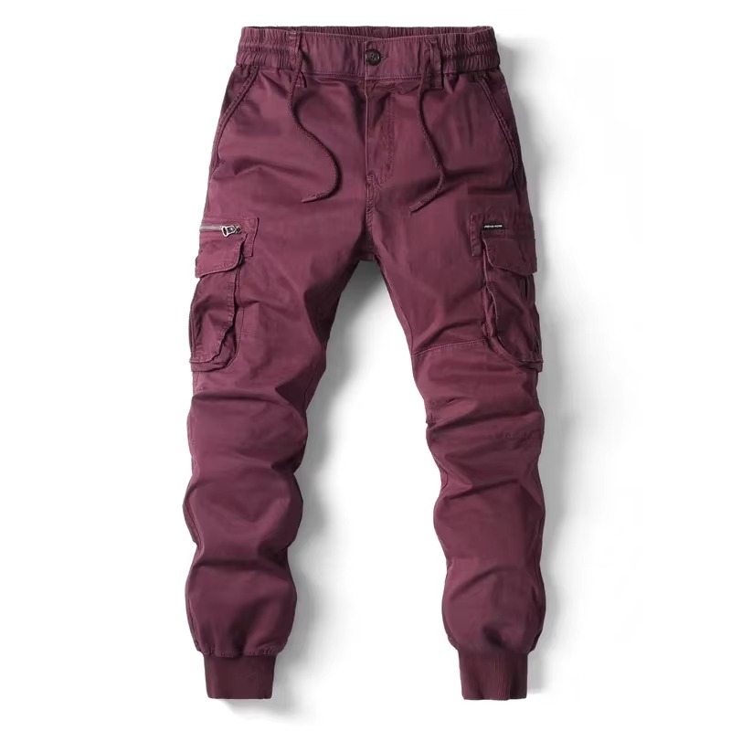 Men's relaxed fit cargo pants in neutral tones with multiple utility pockets for work and travel