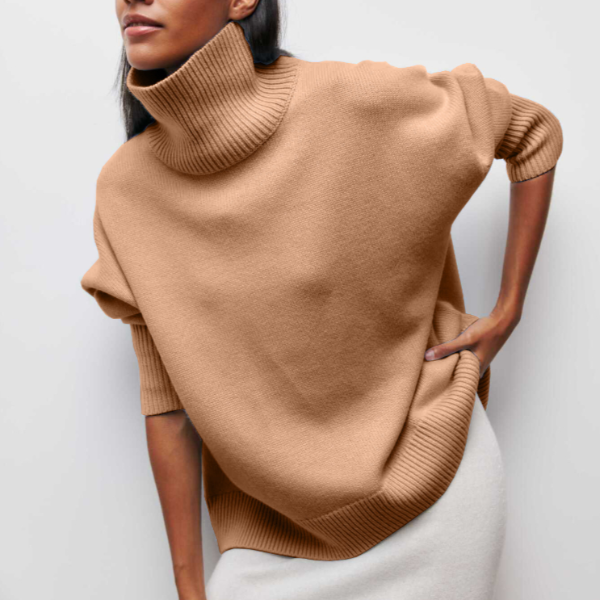 Women's relaxed beige turtleneck sweater with high neckline, loose silhouette for cozy winter style