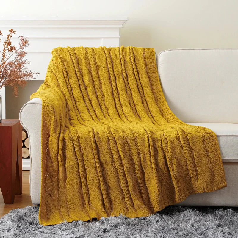 Ultra-soft cable knit throw blanket in neutral tones, textured chunky weave for bed and sofa decor