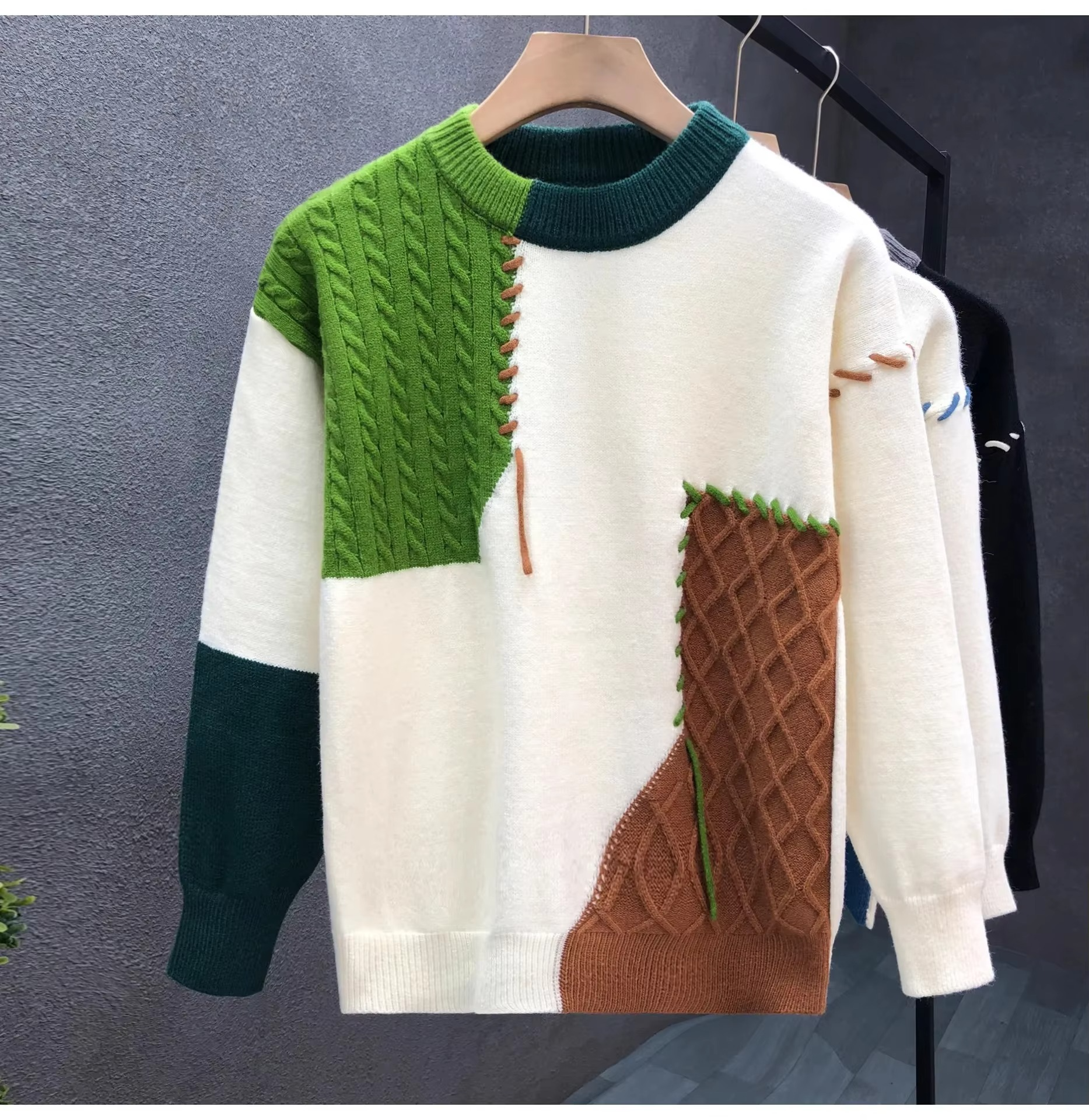 Men's patchwork knit pullover sweater in color-blocked panels with textured streetwear design for fall