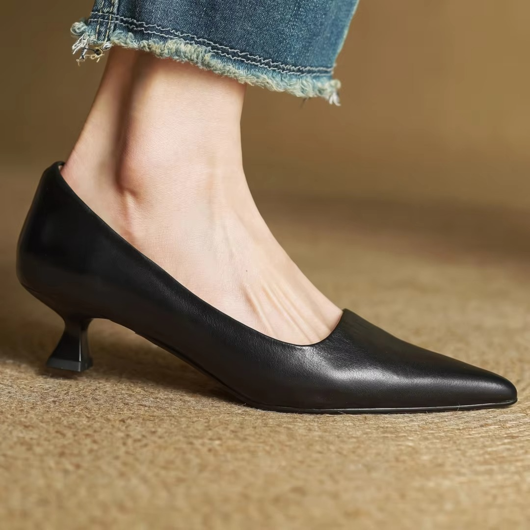Women's black genuine leather pointed toe slip-on pumps with sleek silhouette for professionals