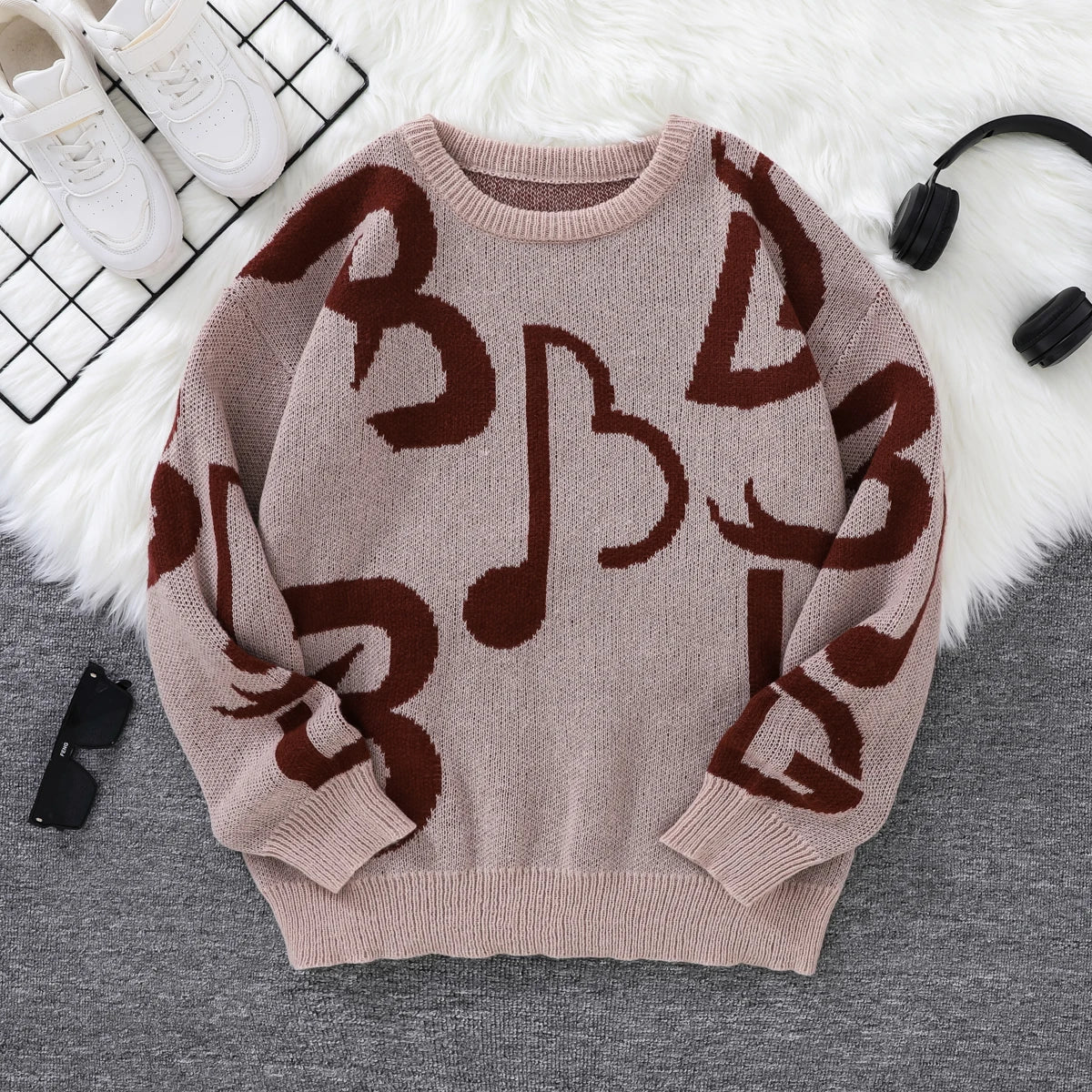 Black white music note pattern knit sweater oversized bold musical graphics cozy soft knit