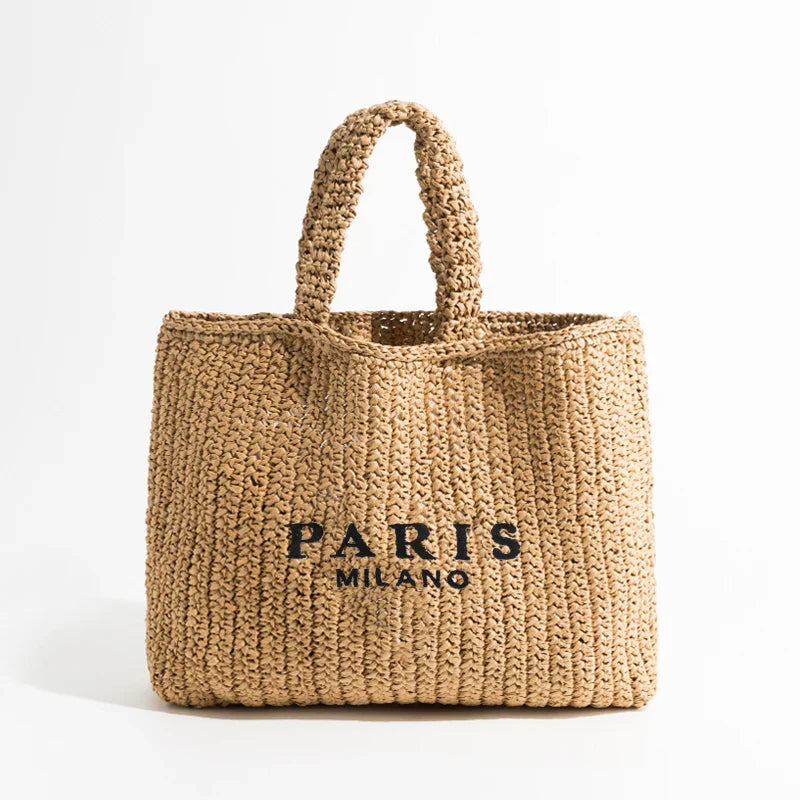 Handwoven sustainable straw tote bag lightweight slim silhouette artisanal beach bag summer essentials